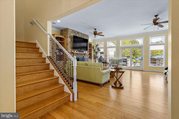 Fireplace, Interior, Living room, Recessed Lighting, Stone Walls, Wood Texture Flooring