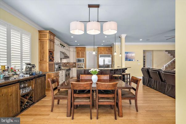 Dining room, Interior, Kitchen, Pendant Lights, Recessed Lighting, Stainless Steel Appliances, Wood Texture Flooring