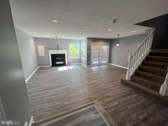 Empty room, Fireplace, Interior, Pendant Lights, Recessed Lighting, Wood Texture Flooring
