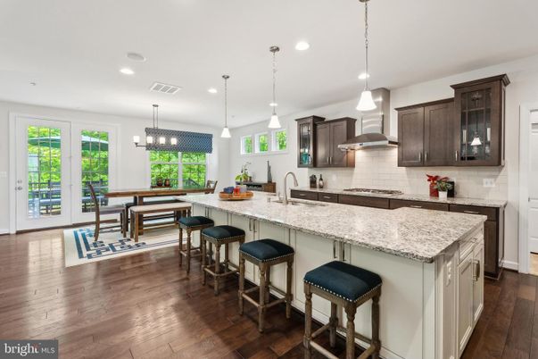 Chandelier, Dining room, Interior, Kitchen, Pendant Lights, Recessed Lighting, Stainless Steel Appliances, Wood Texture Flooring