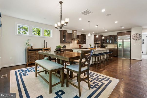 Chandelier, Dining room, Interior, Kitchen, Pendant Lights, Recessed Lighting, Stainless Steel Appliances, Wood Texture Flooring
