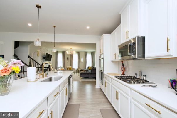 Chandelier, Interior, Kitchen, Living room, Pendant Lights, Recessed Lighting, Stainless Steel Appliances, Wood Texture Flooring