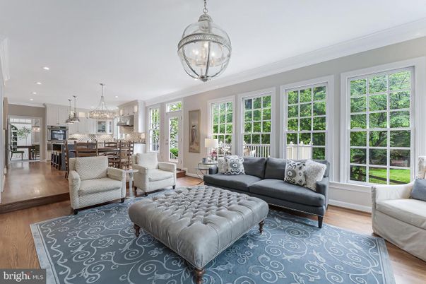 Chandelier, Interior, Kitchen, Living room, Pendant Lights, Recessed Lighting, Stainless Steel Appliances, Wood Texture Flooring