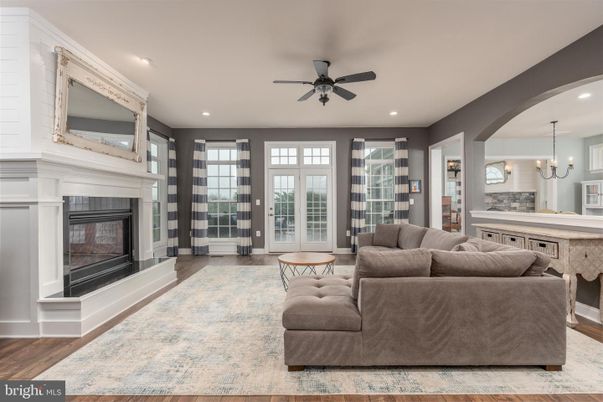 Chandelier, Dining room, Fireplace, Interior, Living room, Pendant Lights, Recessed Lighting, Wood Texture Flooring