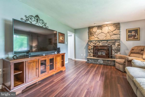 Fireplace, Interior, Living room, Recessed Lighting, Stone Walls, Wood Texture Flooring