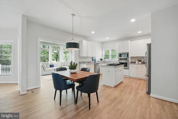 Dining room, Interior, Kitchen, Pendant Lights, Recessed Lighting, Stainless Steel Appliances, Wood Texture Flooring