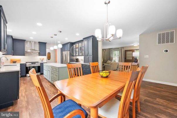 Dining room, Interior, Kitchen, Pendant Lights, Recessed Lighting, Stainless Steel Appliances, Wood Texture Flooring