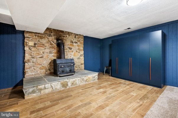 Empty room, Fireplace, Interior, Stone Walls, Wood Texture Flooring