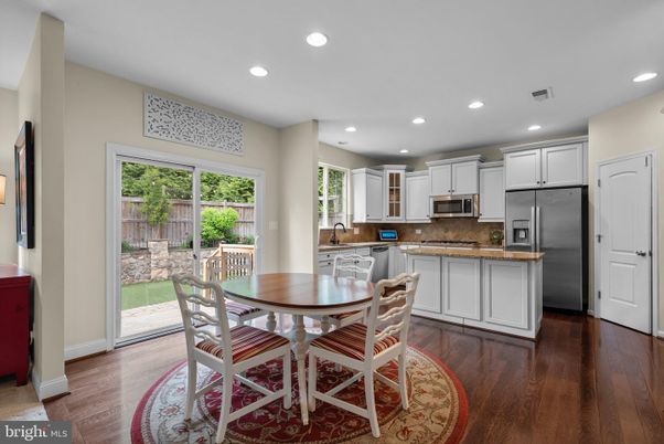Dining room, Interior, Kitchen, Recessed Lighting, Stainless Steel Appliances, Wood Texture Flooring