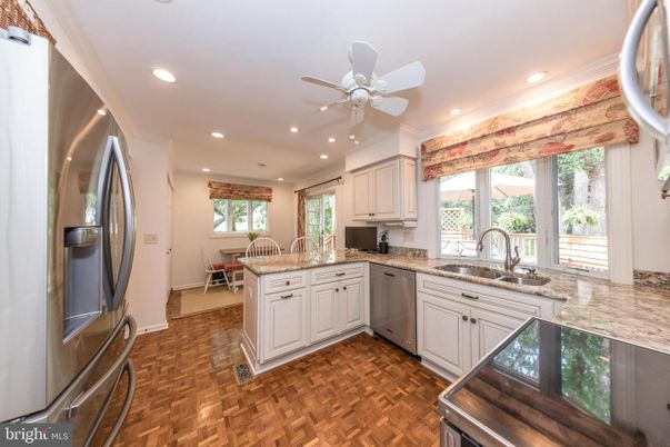 Dining room, Interior, Kitchen, Recessed Lighting, Stainless Steel Appliances, Wood Texture Flooring