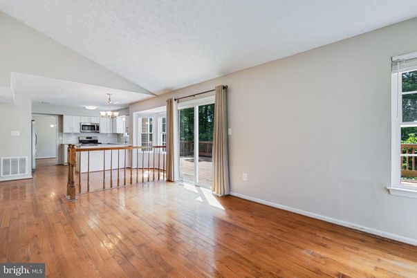 Empty room, Interior, Kitchen, Pendant Lights, Stainless Steel Appliances, Wood Texture Flooring