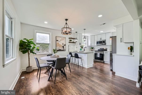 Chandelier, Dining room, Interior, Kitchen, Pendant Lights, Recessed Lighting, Stainless Steel Appliances, Wood Texture Flooring