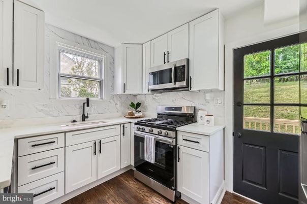 Interior, Kitchen, Marble Walls, Stainless Steel Appliances, Wood Texture Flooring
