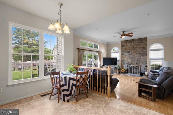 Dining room, Fireplace, Interior, Pendant Lights, Stone Walls, Wood Texture Flooring