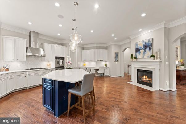 Fireplace, Interior, Kitchen, Pendant Lights, Recessed Lighting, Stainless Steel Appliances, Wood Texture Flooring