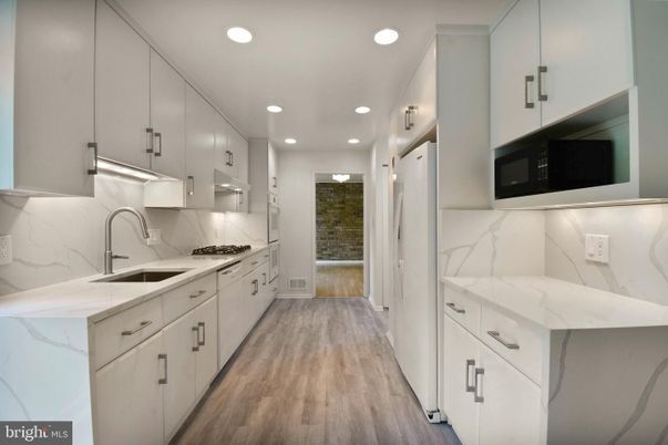 Interior, Kitchen, Marble Walls, Recessed Lighting, Wood Texture Flooring
