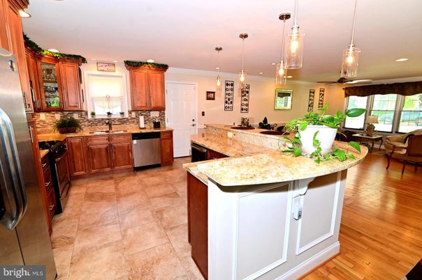 Dining room, Interior, Kitchen, Pendant Lights, Recessed Lighting, Stainless Steel Appliances, Wood Texture Flooring