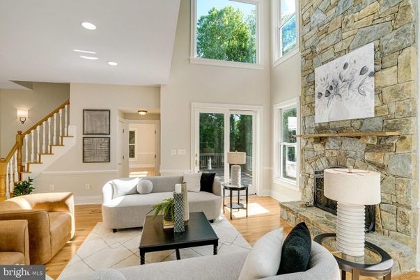 Fireplace, Interior, Living room, Recessed Lighting, Stone Walls, Wood Texture Flooring