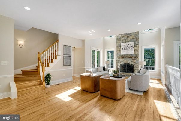 Fireplace, Interior, Living room, Recessed Lighting, Stone Walls, Wood Texture Flooring