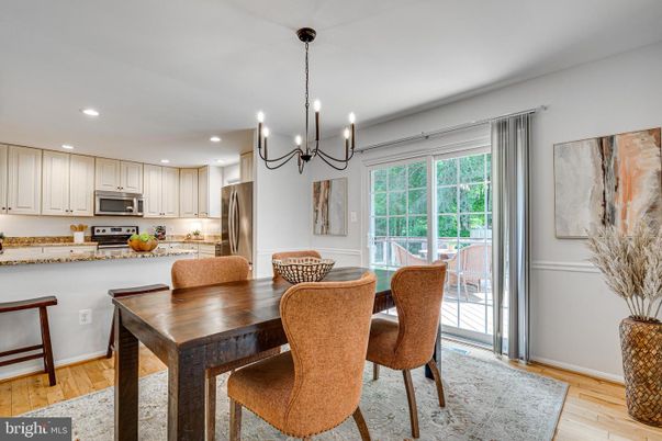 Chandelier, Dining room, Interior, Kitchen, Pendant Lights, Recessed Lighting, Stainless Steel Appliances, Wood Texture Flooring