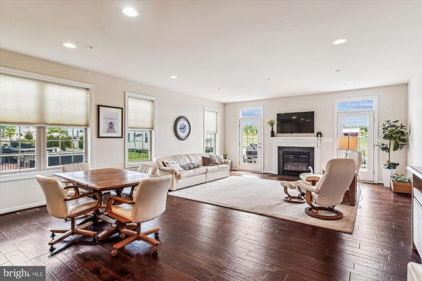 Dining room, Fireplace, Interior, Living room, Recessed Lighting, Wood Texture Flooring