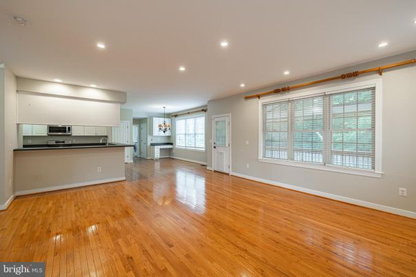 Chandelier, Empty room, Interior, Kitchen, Recessed Lighting, Stainless Steel Appliances, Wood Texture Flooring