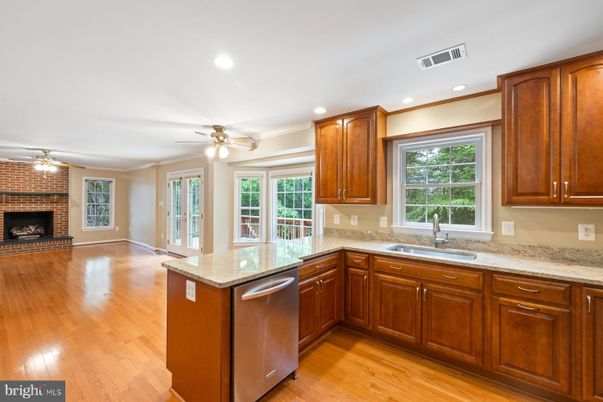 Fireplace, Interior, Kitchen, Recessed Lighting, Stone Walls, Wood Texture Flooring