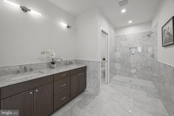 Bathroom, Dual Sink Vanities, Interior, Marble, Marble Walls, Recessed Lighting