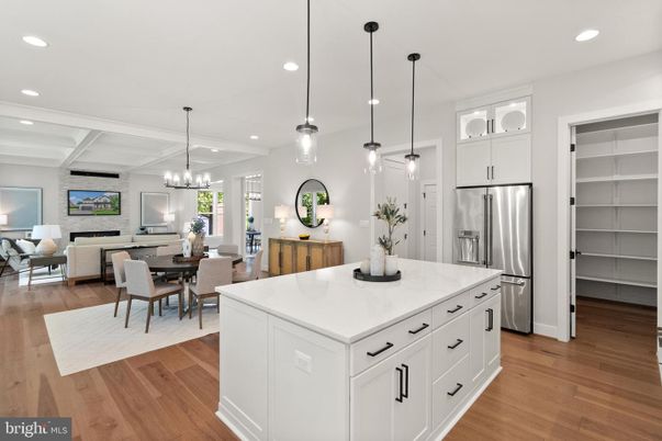 Chandelier, Dining room, Interior, Kitchen, Living room, Pendant Lights, Recessed Lighting, Stainless Steel Appliances, Wood Texture Flooring