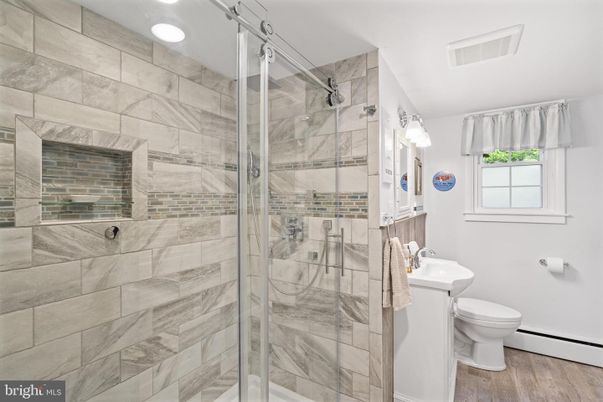 Bathroom, Fireplace, Glass Shower, Interior, Recessed Lighting, Wood Texture Flooring