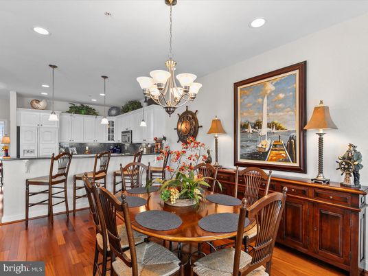 Chandelier, Dining room, Interior, Kitchen, Pendant Lights, Recessed Lighting, Stainless Steel Appliances, Wood Texture Flooring
