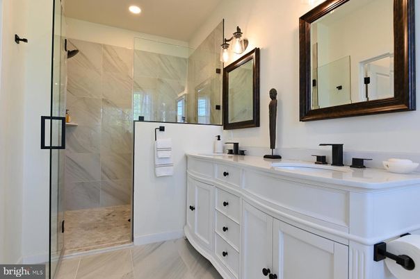 Bathroom, Dual Sink Vanities, Glass Shower, Interior, Marble Walls, Recessed Lighting