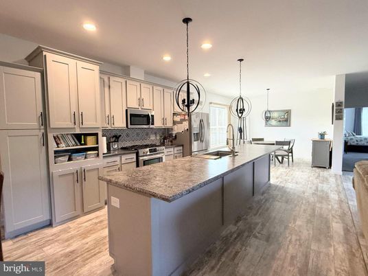 Dining room, Interior, Kitchen, Pendant Lights, Recessed Lighting, Stainless Steel Appliances, Wood Texture Flooring