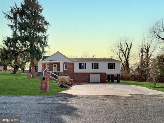 Attached, Backyard, Exterior, Facade, Brick Facade, Raised Ranch
