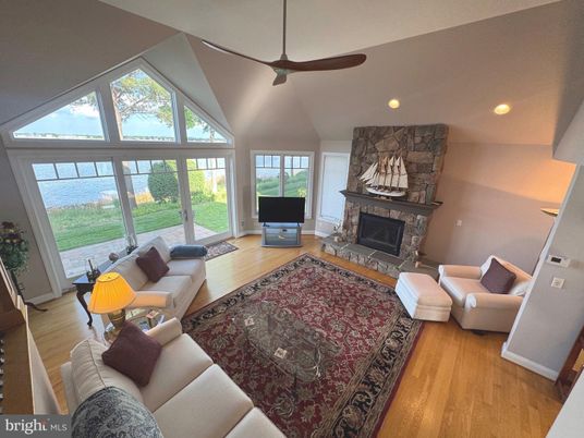 Fireplace, Interior, Living room, Recessed Lighting, Stone Walls, Wood Texture Flooring