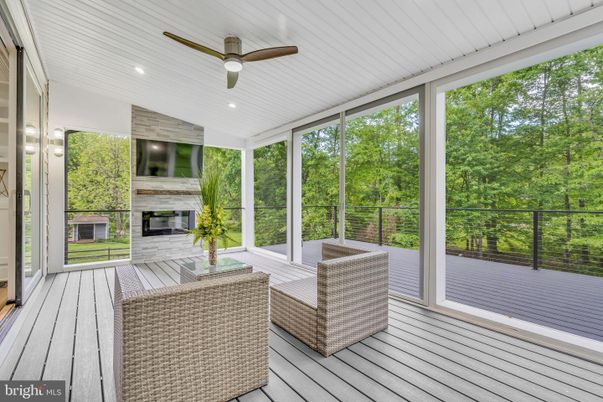 Fireplace, Interior, Recessed Lighting, Sun Room, Wood Texture Flooring