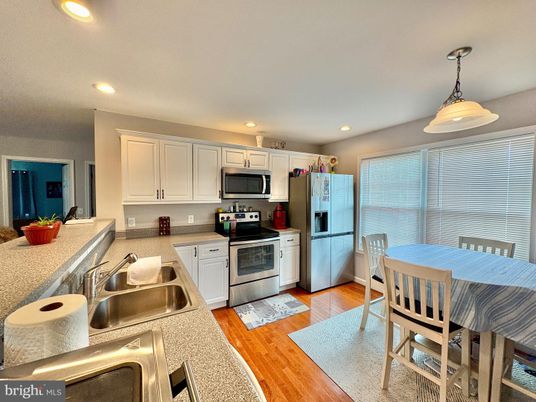 Dining room, Interior, Kitchen, Pendant Lights, Recessed Lighting, Stainless Steel Appliances, Wood Texture Flooring