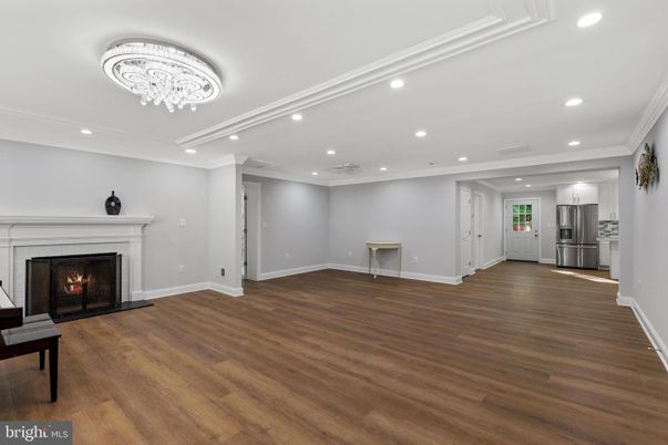 Chandelier, Empty room, Fireplace, Interior, Recessed Lighting, Wood Texture Flooring