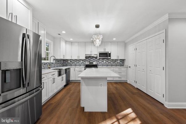 Chandelier, Interior, Kitchen, Pendant Lights, Recessed Lighting, Stainless Steel Appliances, Wood Texture Flooring