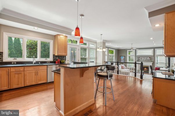 Fireplace, Interior, Kitchen, Living room, Pendant Lights, Recessed Lighting, Stainless Steel Appliances, Wood Texture Flooring