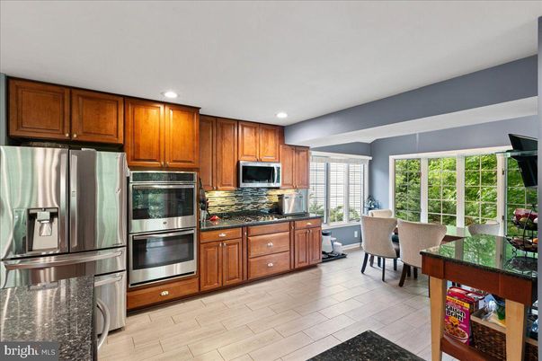 Dining room, Interior, Kitchen, Recessed Lighting, Stainless Steel Appliances, Wood Texture Flooring