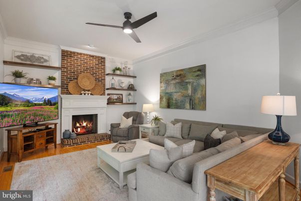 Fireplace, Interior, Living room, Recessed Lighting, Stone Walls, Wood Texture Flooring