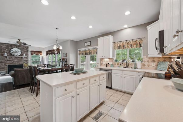 Dining room, Fireplace, Interior, Kitchen, Pendant Lights, Recessed Lighting, Stainless Steel Appliances, Stone Walls