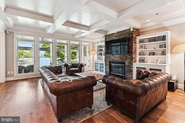 Fireplace, Interior, Living room, Recessed Lighting, Stone Walls, Wood Texture Flooring