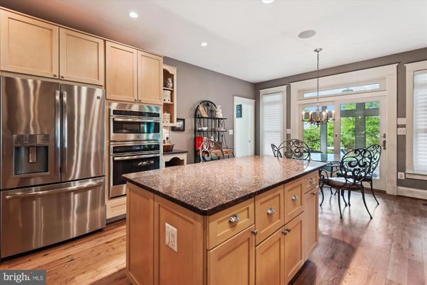 Chandelier, Dining room, Interior, Kitchen, Pendant Lights, Recessed Lighting, Stainless Steel Appliances, Wood Texture Flooring