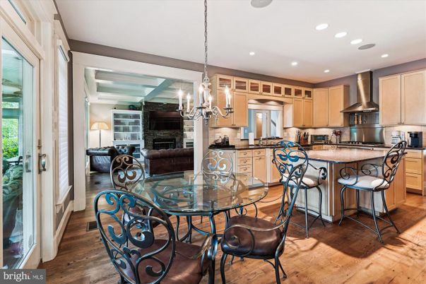 Chandelier, Dining room, Fireplace, Interior, Kitchen, Living room, Pendant Lights, Recessed Lighting, Stainless Steel Appliances, Wood Texture Flooring