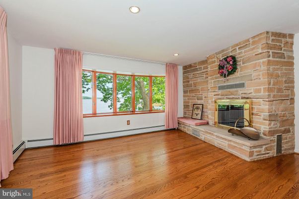 Empty room, Fireplace, Interior, Recessed Lighting, Stone Walls, Wood Texture Flooring