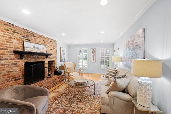 Fireplace, Interior, Living room, Recessed Lighting, Stone Walls, Wood Texture Flooring