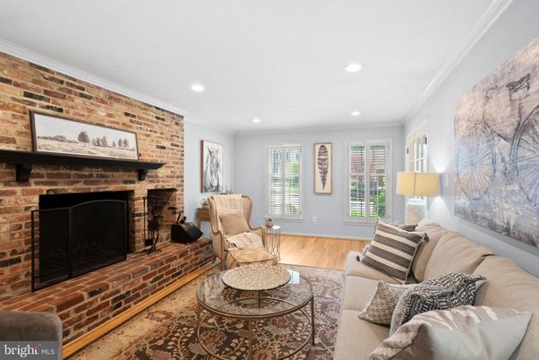 Fireplace, Interior, Living room, Recessed Lighting, Stone Walls, Wood Texture Flooring