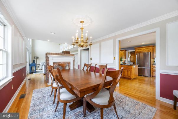 Chandelier, Dining room, Fireplace, Interior, Kitchen, Recessed Lighting, Stainless Steel Appliances, Wood Texture Flooring